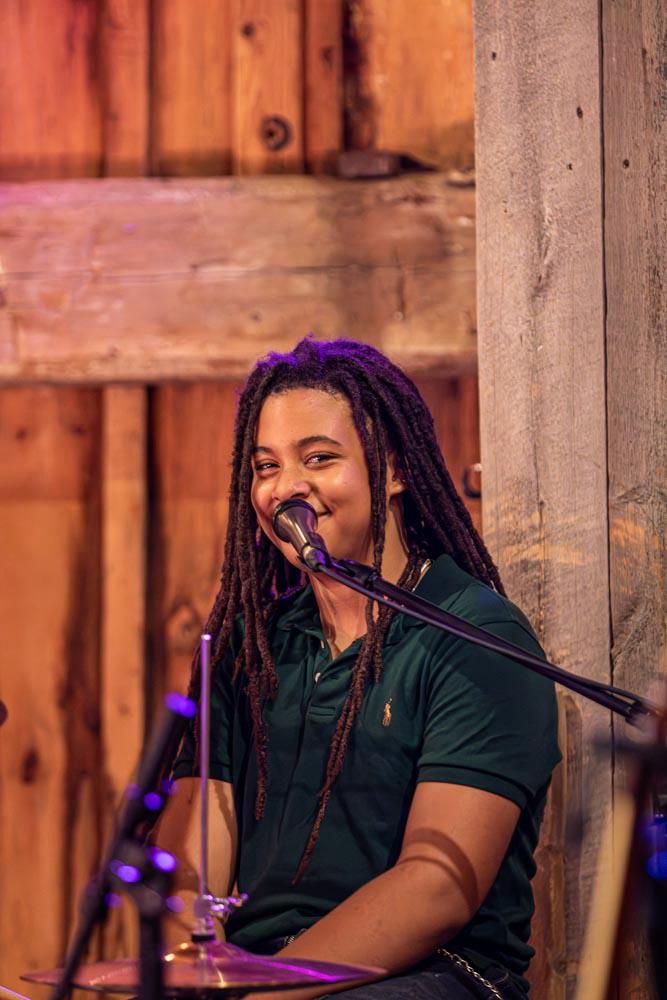 Drummer smiling at the microphone