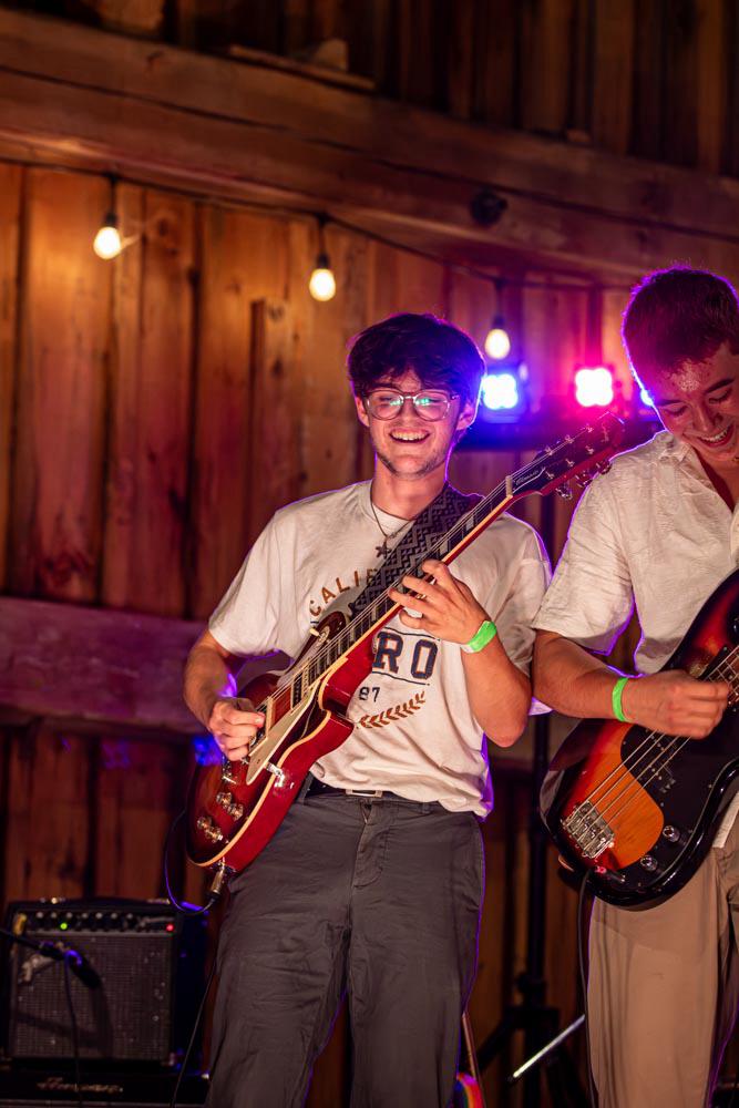 Guitarist smiling while playing