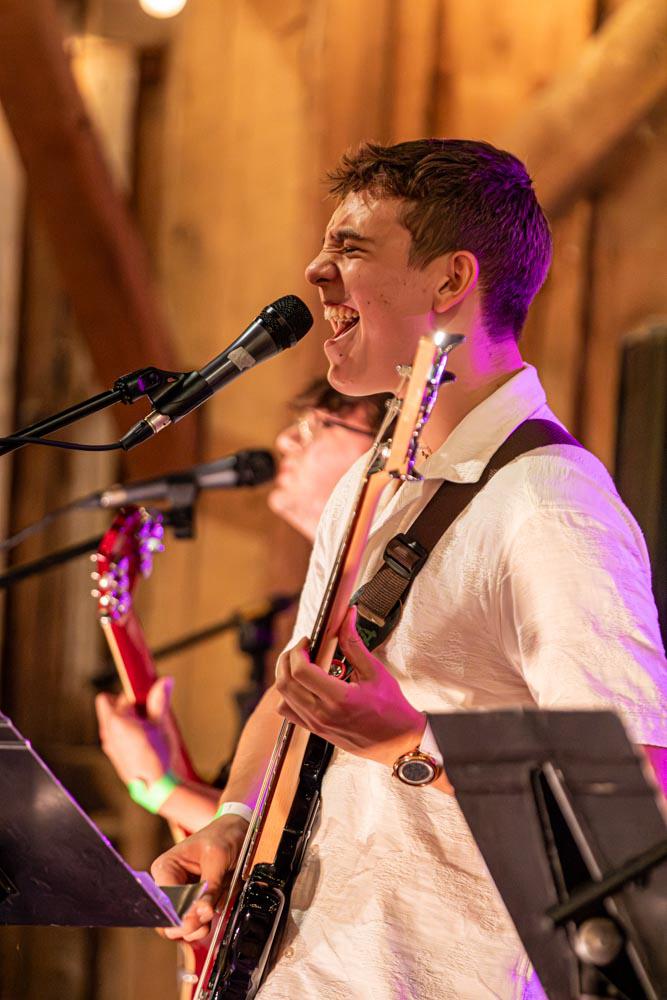 Bassist singing at the microphone